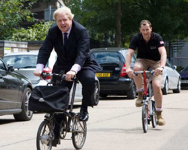 Boris Johnson riding a brompton bike